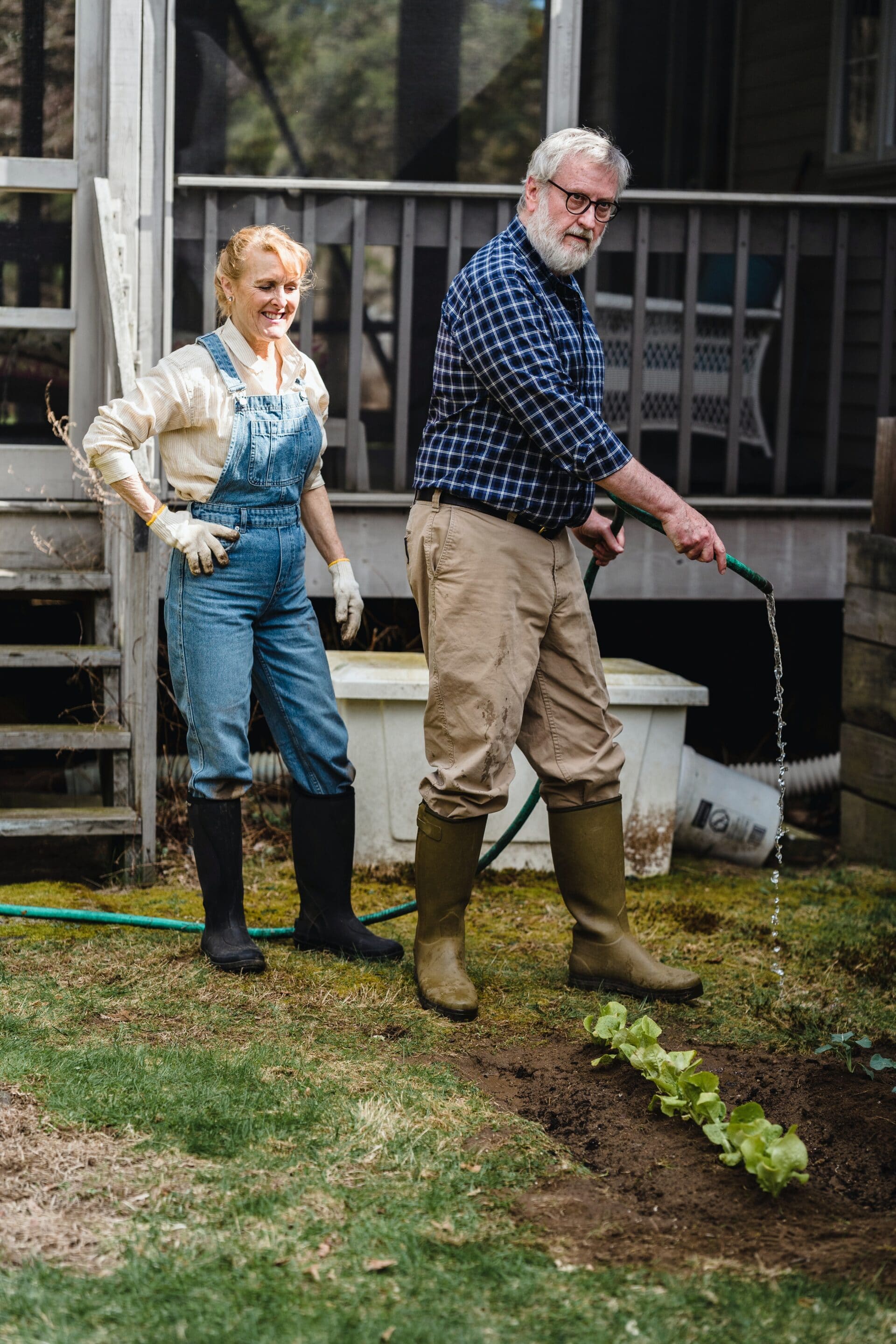 watering a yard from a rain barrel